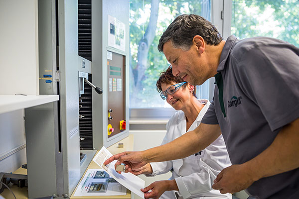 Low cationic starches in surface sizing