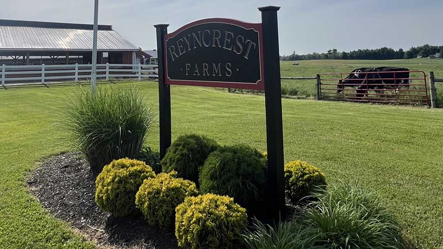 A large sign reads Reyncrest Farms. A large sign reads Reyncrest Farms.
