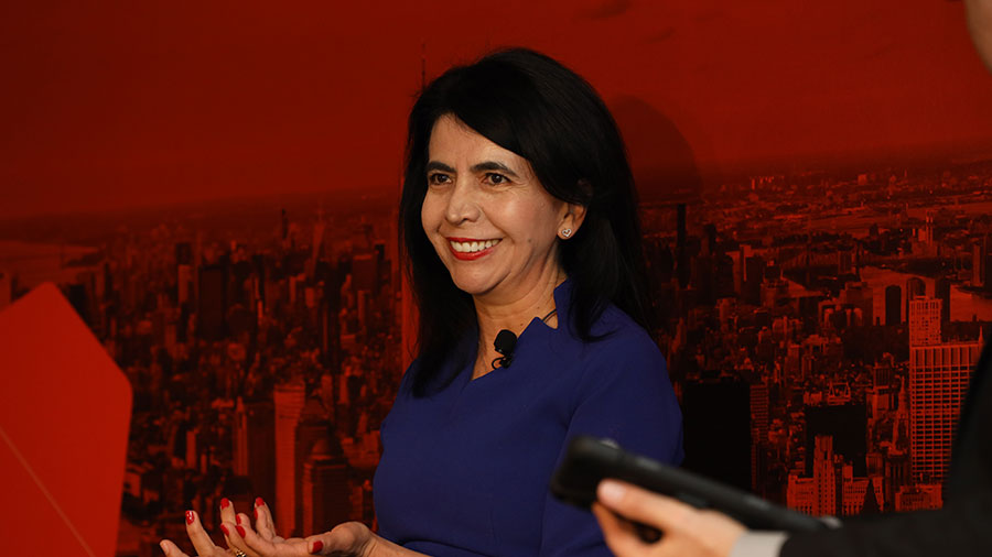 Pilar Cruz smiles while speaking at a Climate Week panel on resilient food system. Pilar Cruz smiles while speaking at a Climate Week panel on resilient food system.