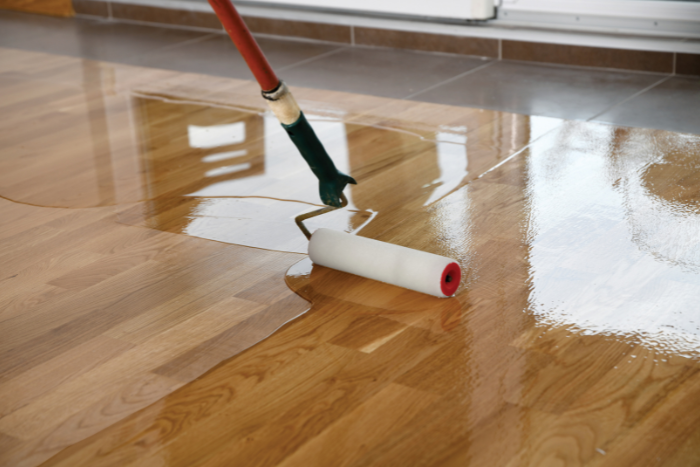 paint roller on wood floor